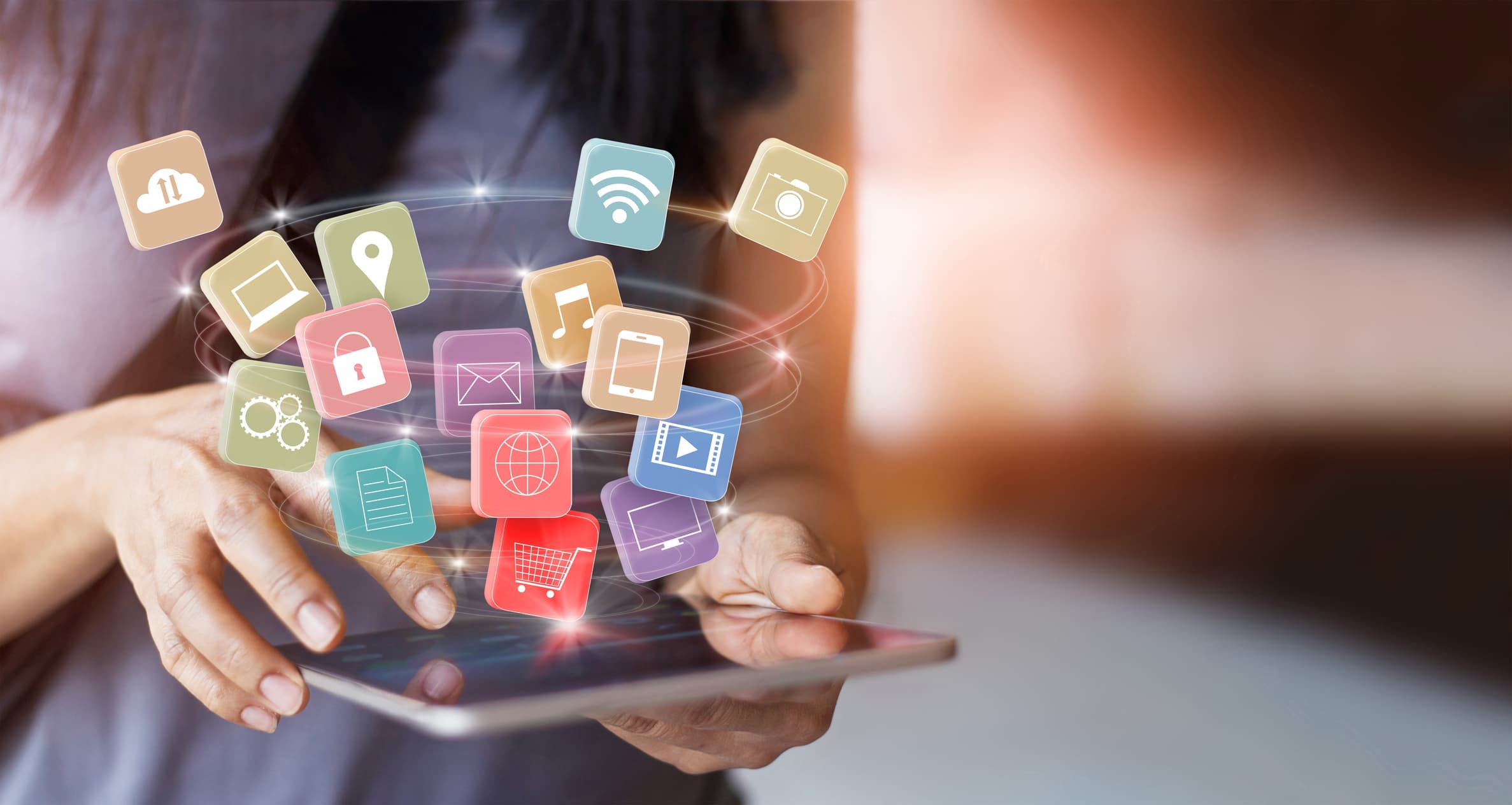 A person using a personal smartphone at a desk; Microsoft 365 work data lives in a contained app-protection profile alongside personal apps.